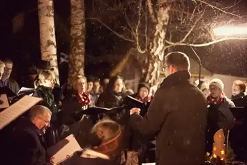 The Vorau Choir signing outside when snowing, the Christmas time 2017.